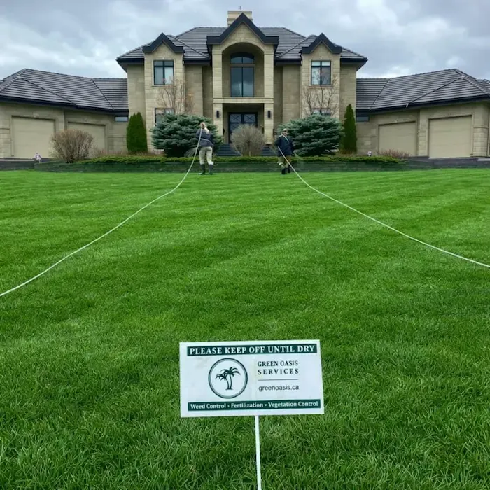 Green Oasis technician treating park greenspace