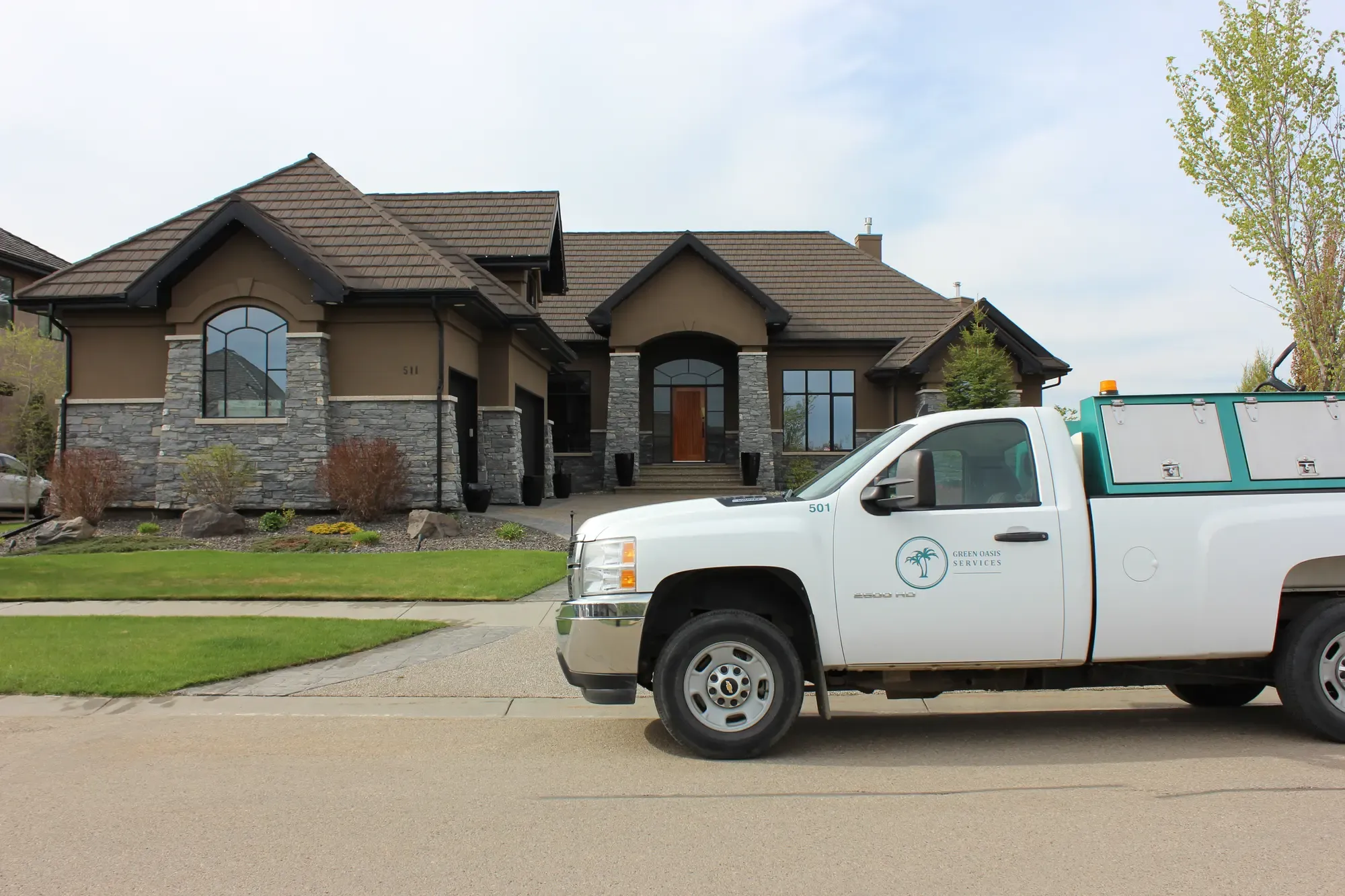 Green Oasis truck at luxury residential property